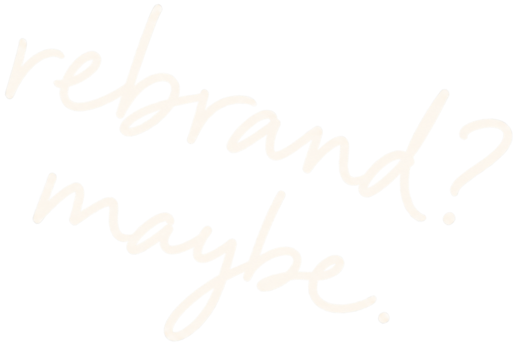 Text that reads 'rebrand? maybe' written in cursive, glowing white on a black background.