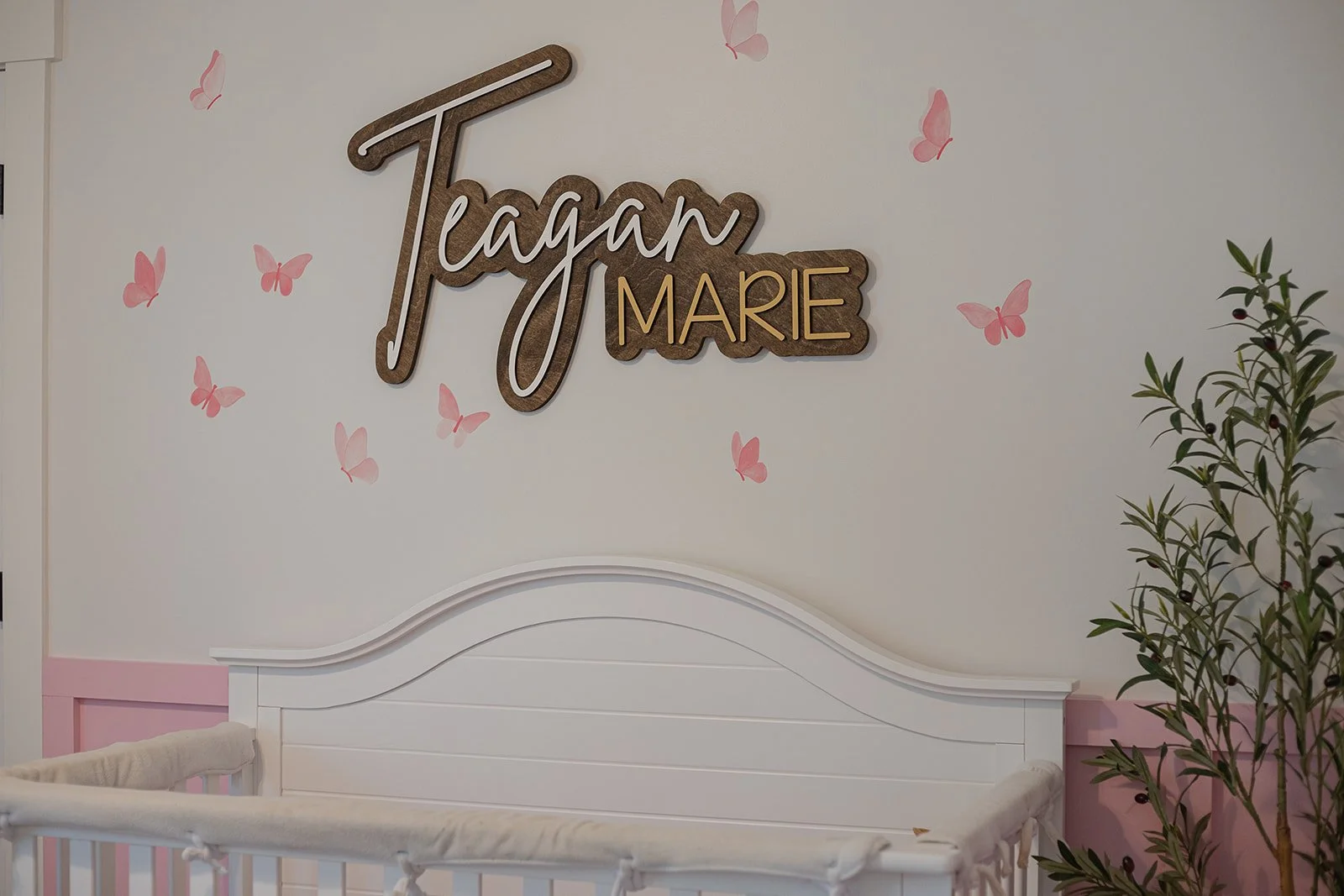 Pretty accent wall of a baby girl's nursery.