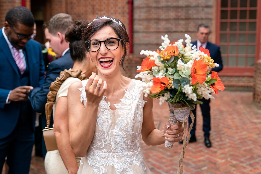 bride laughs after getting married at Hillingdon registry office