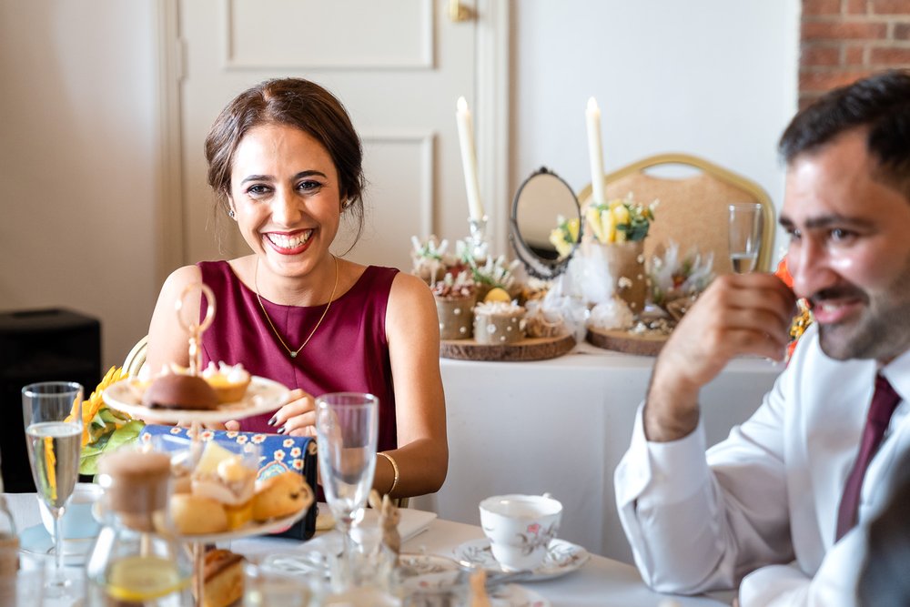 bridesmaid laughs during Cavendish house wedding breakfast