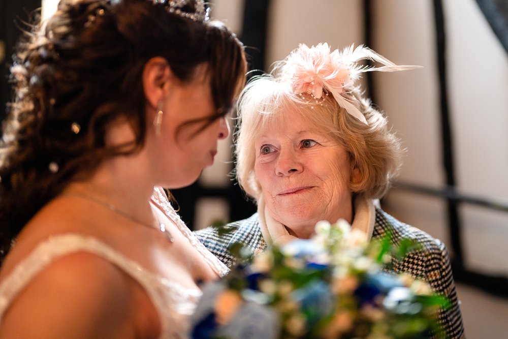 Wedding guest congratulates a Barn Hotel Ruislip bride