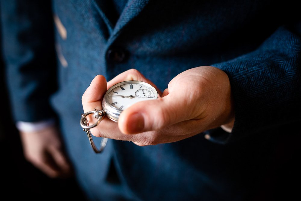 groom-with-pocket-watch-wasing-park