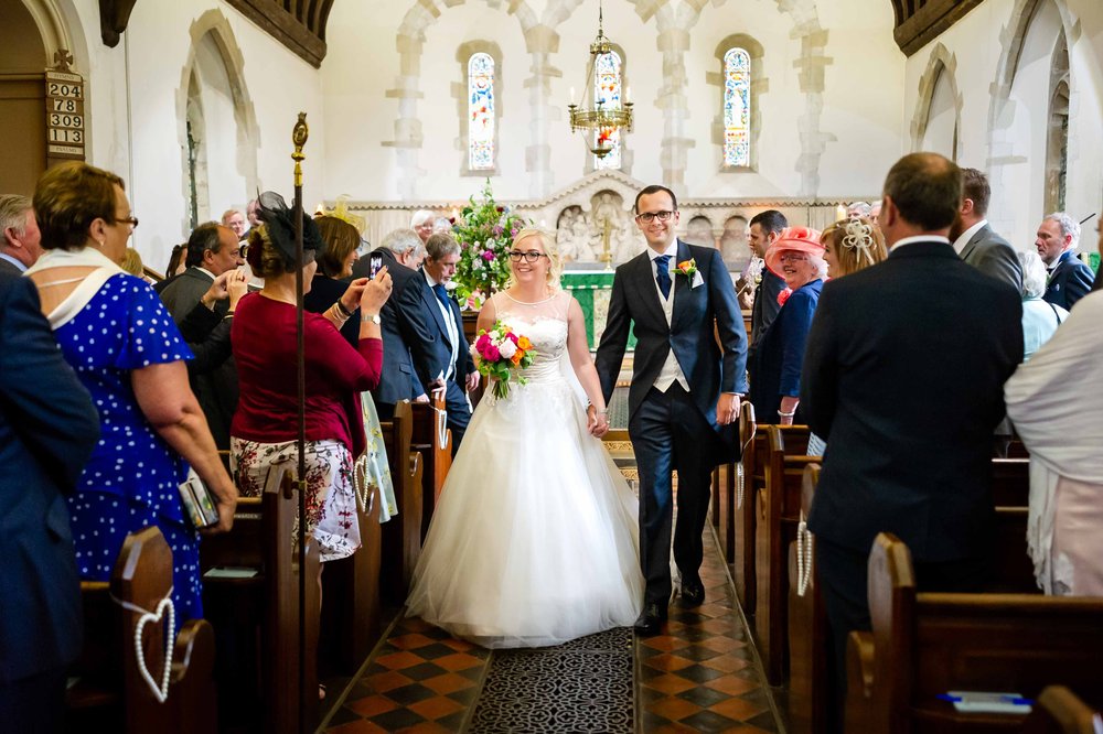 Bride and groom recessional at a Hampshire church