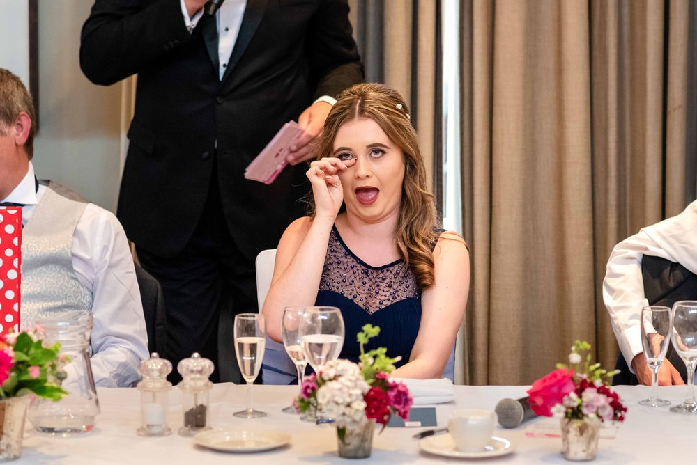 Bridesmaid cries with laughter during speeches at Warbrook House