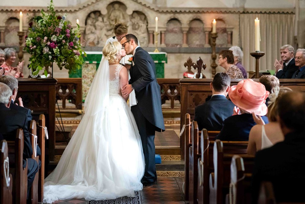 First kiss at a Hampshire village church wedding