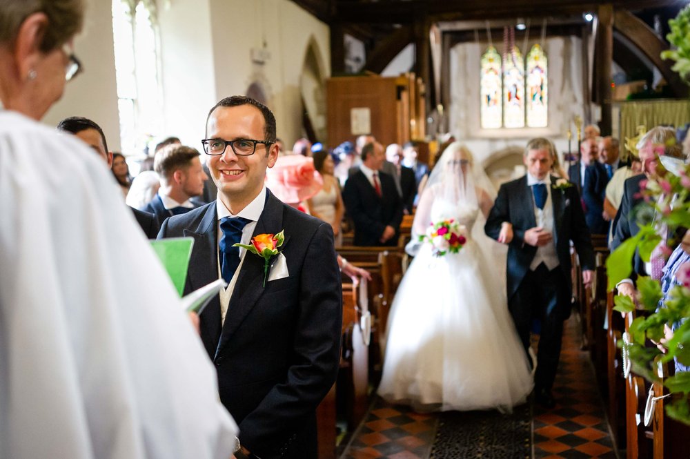 Bride and her father walk down the aisle in Hampshire