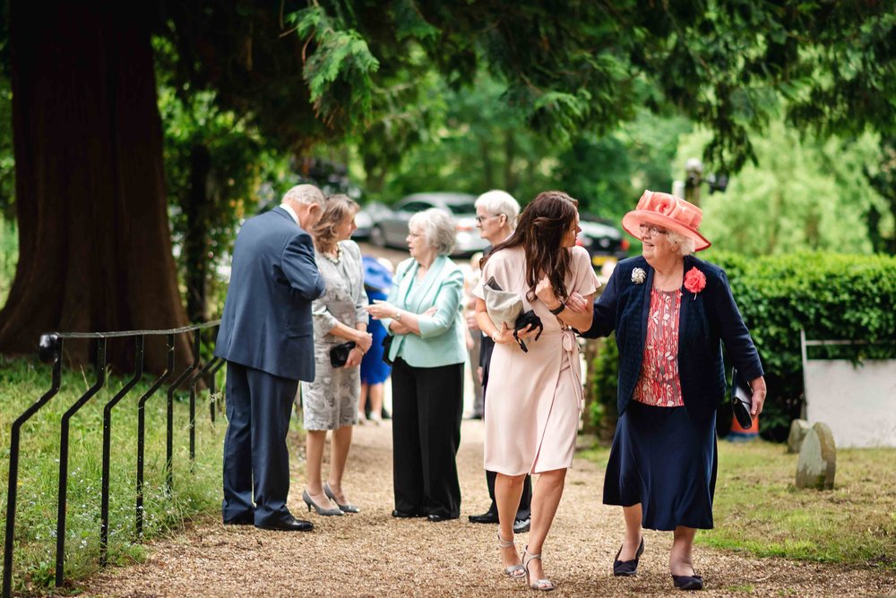 Guests arrive to Hampshire village church wedding