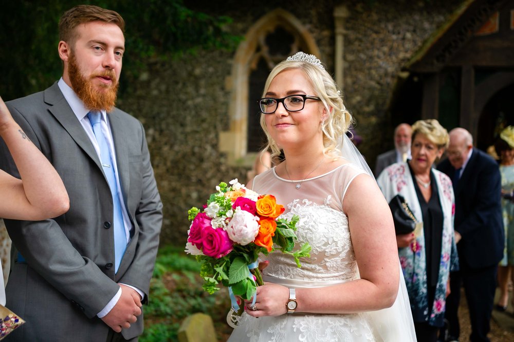 Bride walks through wedding guests in Hampshire