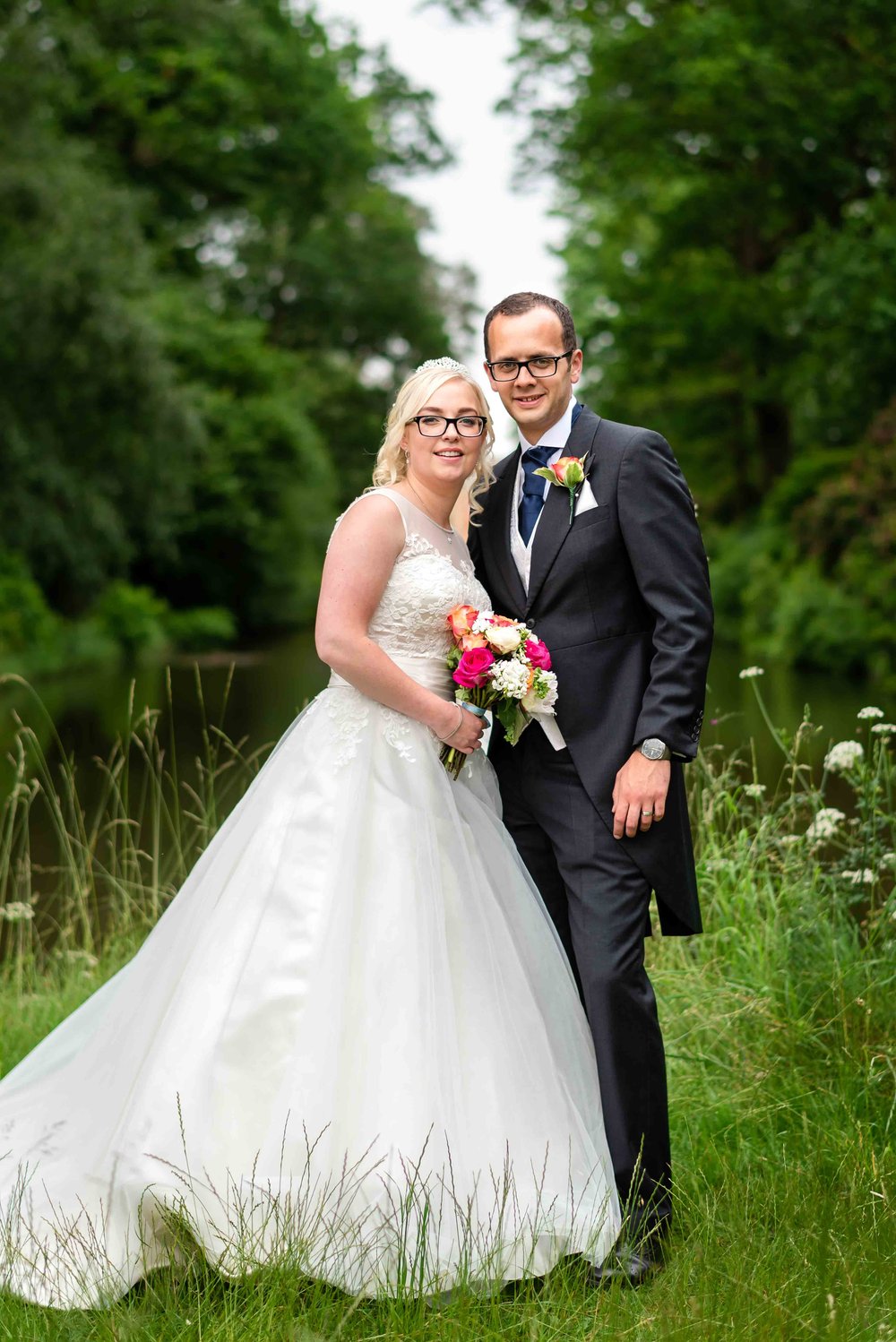 Newlyweds pose in the grounds of Warbrook House