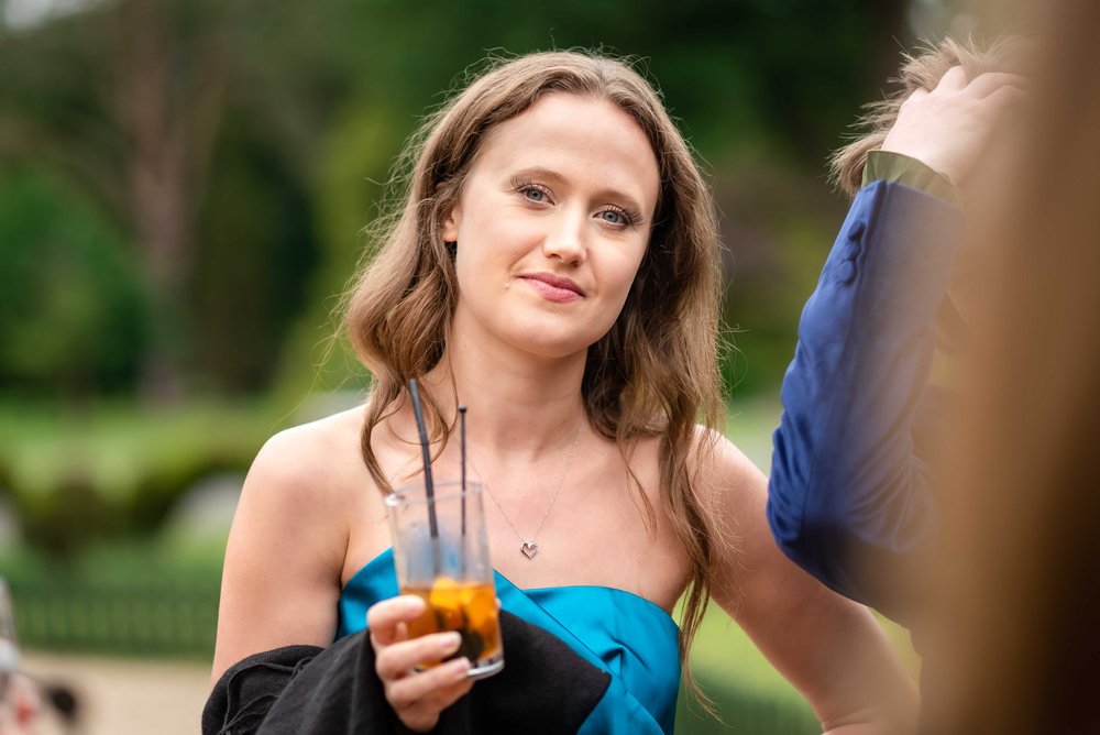 Wedding guest in blue silk dress