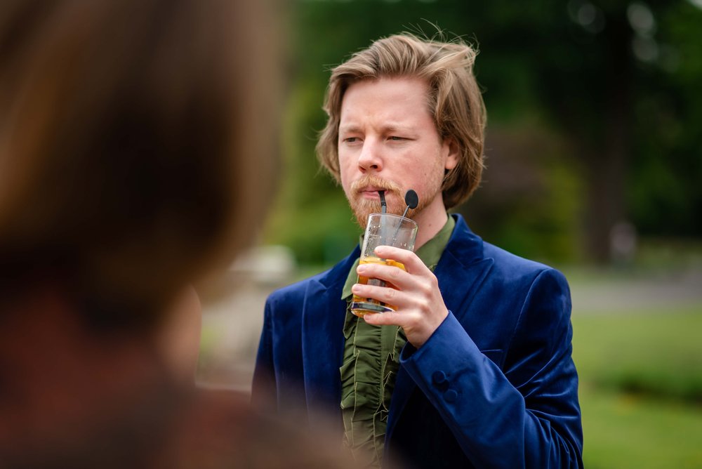 Wedding guest in blue velvet jacket