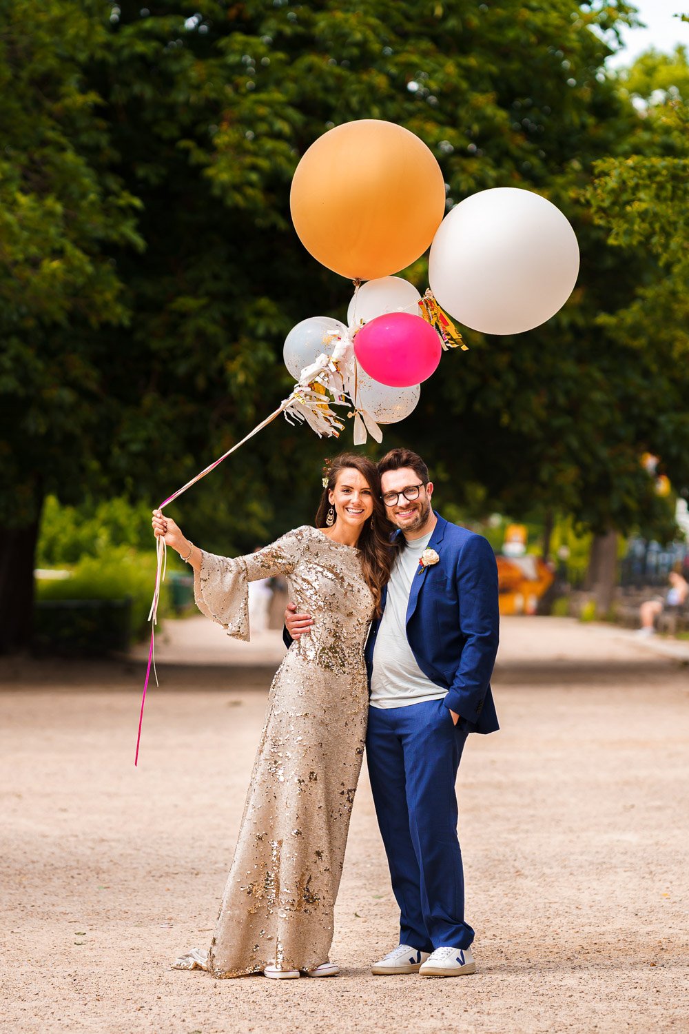 Newlyweds pose with balloons on Richmond Hill