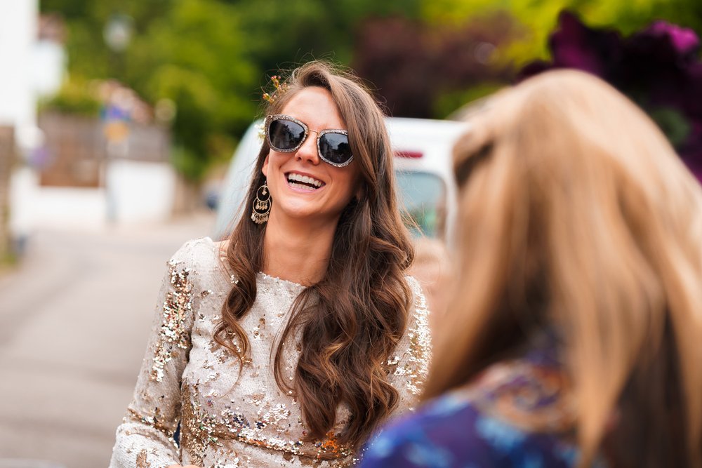 Bride in sunglasses outside Twickenham pub
