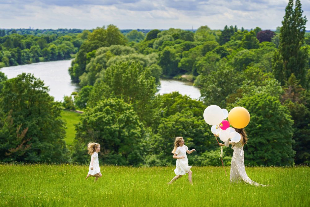 Bride and flower girls with balloons on Richmond Hill