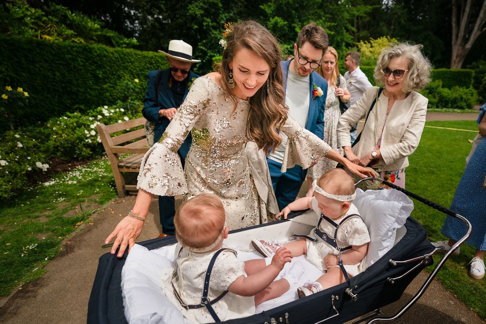 Bride with twin girls in pram at York House