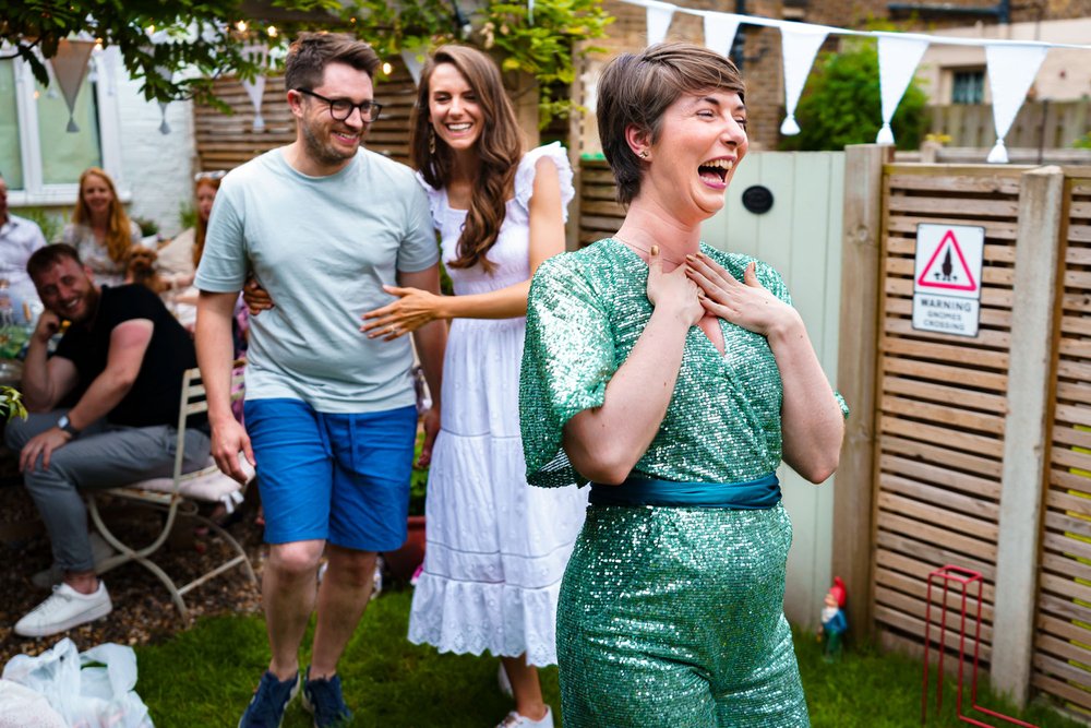 Sparkly green trouser suit wedding reception