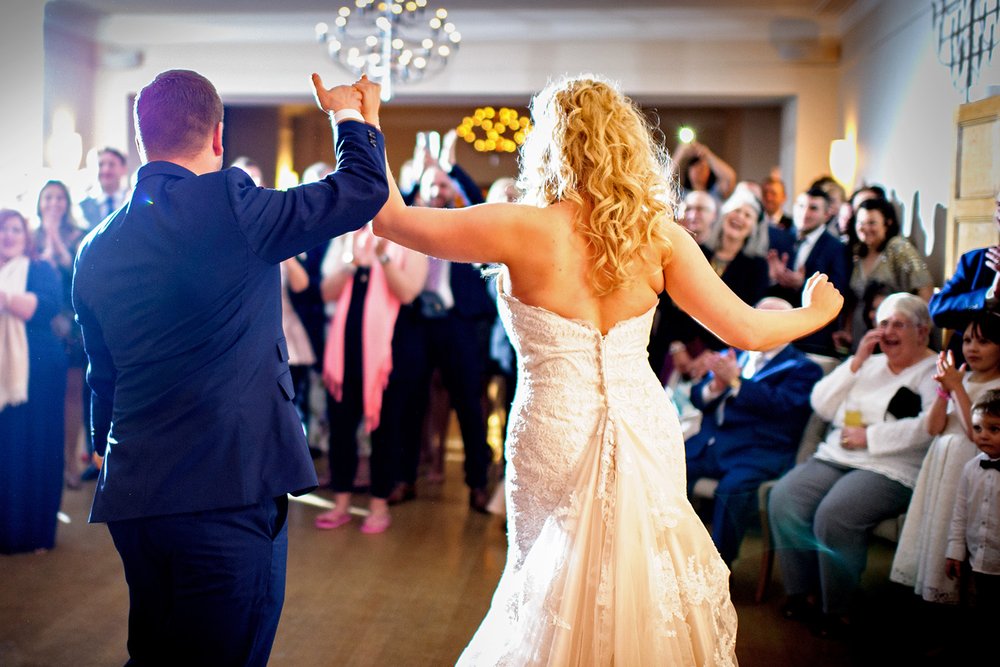 Bride and Groom finish their first dance at Coombe Lodge