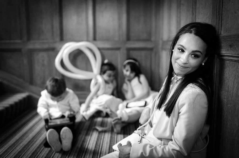 Wedding guest relaxes with children at Coombe Lodge