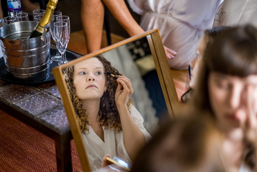 Bridesmaid applies eyeliner at The Olde Bell, Hurley