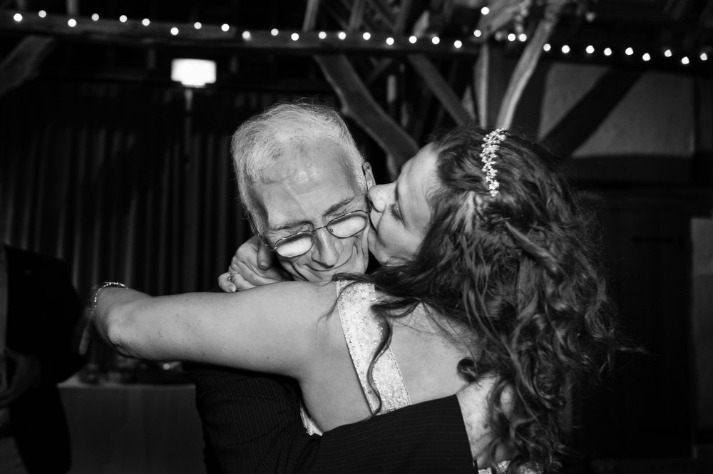Father hugs his bride daughter during Herons Farm wedding