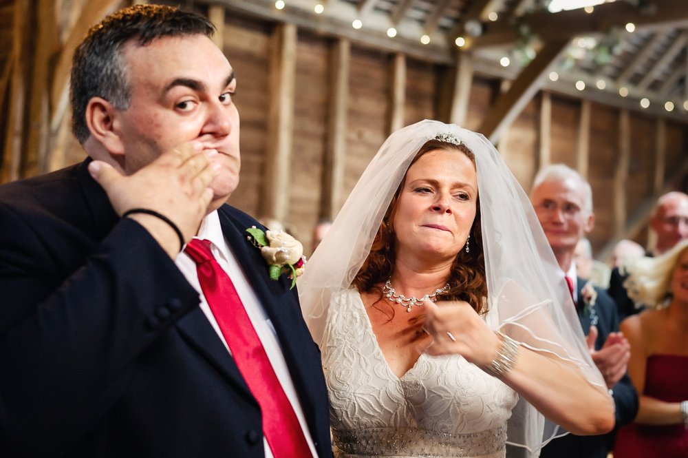 Groom wipes away lipstick during wedding ceremony