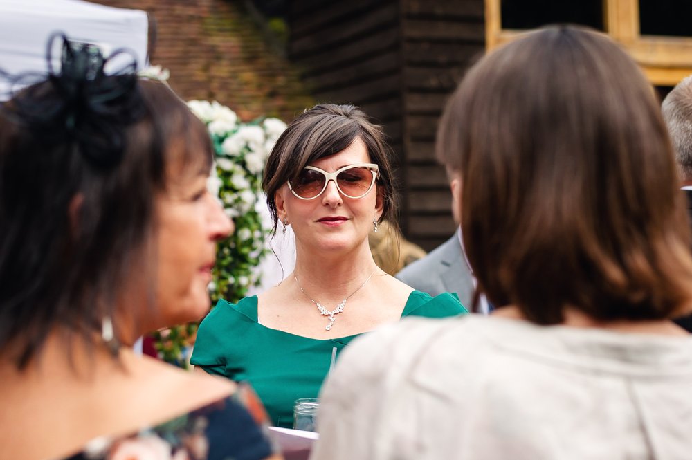 Herons Farm wedding guest in retro sunglasses