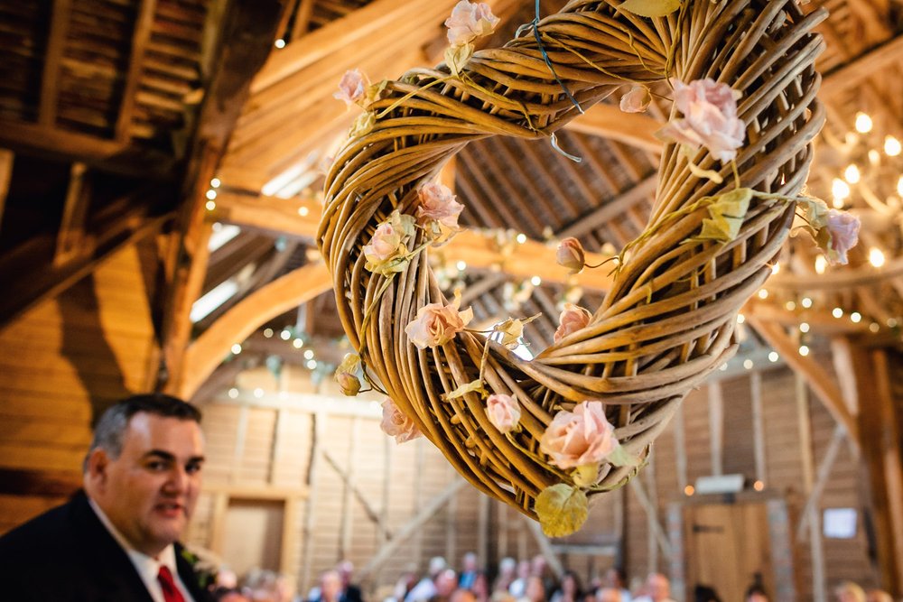 Wicker heart hangs at a Berkshire wedding