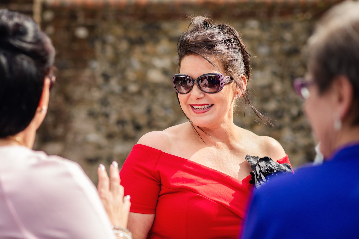 Summer wedding guest wearing sunglasses in Berkshire
