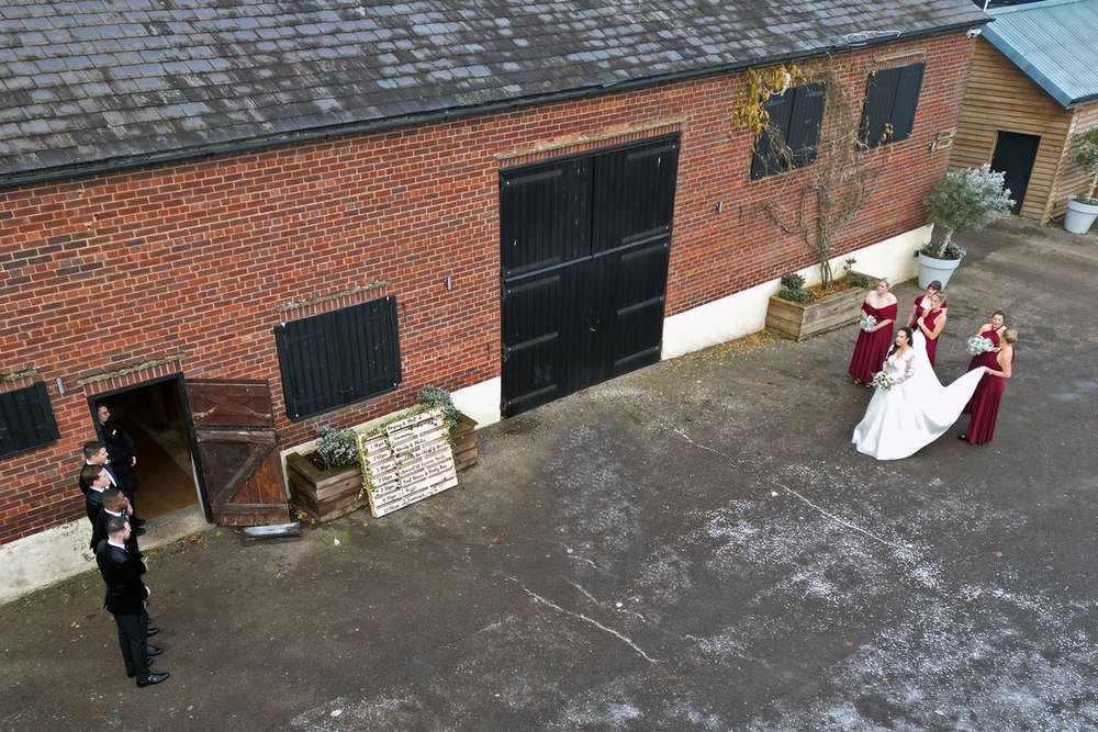 overhead view of bridal party arriving at Milling Barn