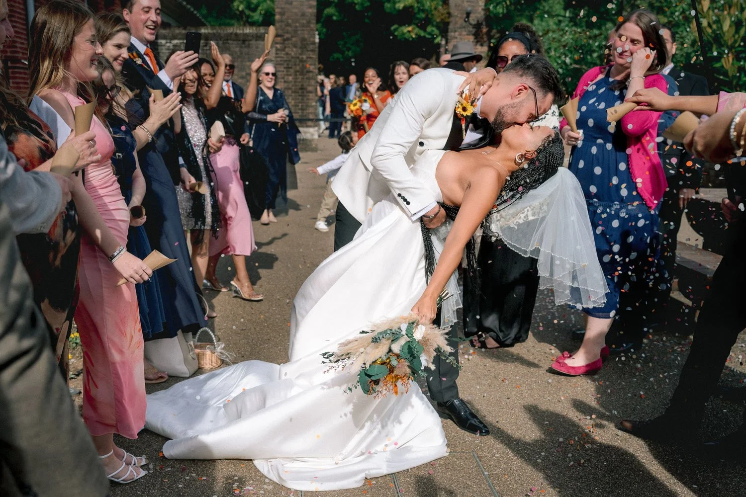 Bride and Groom dip during confetti at York House photographed by Uxbridge wedding photographer Steve Bagness