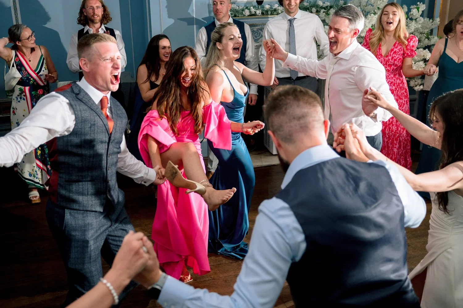 A shoe flies off a woman's foot during excitable Romanian dancing at Hutton Hall 