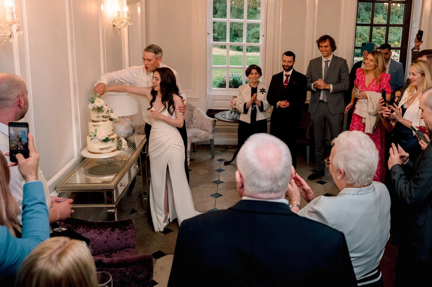 Bride and Groom cutting their cake at Hutton Hall