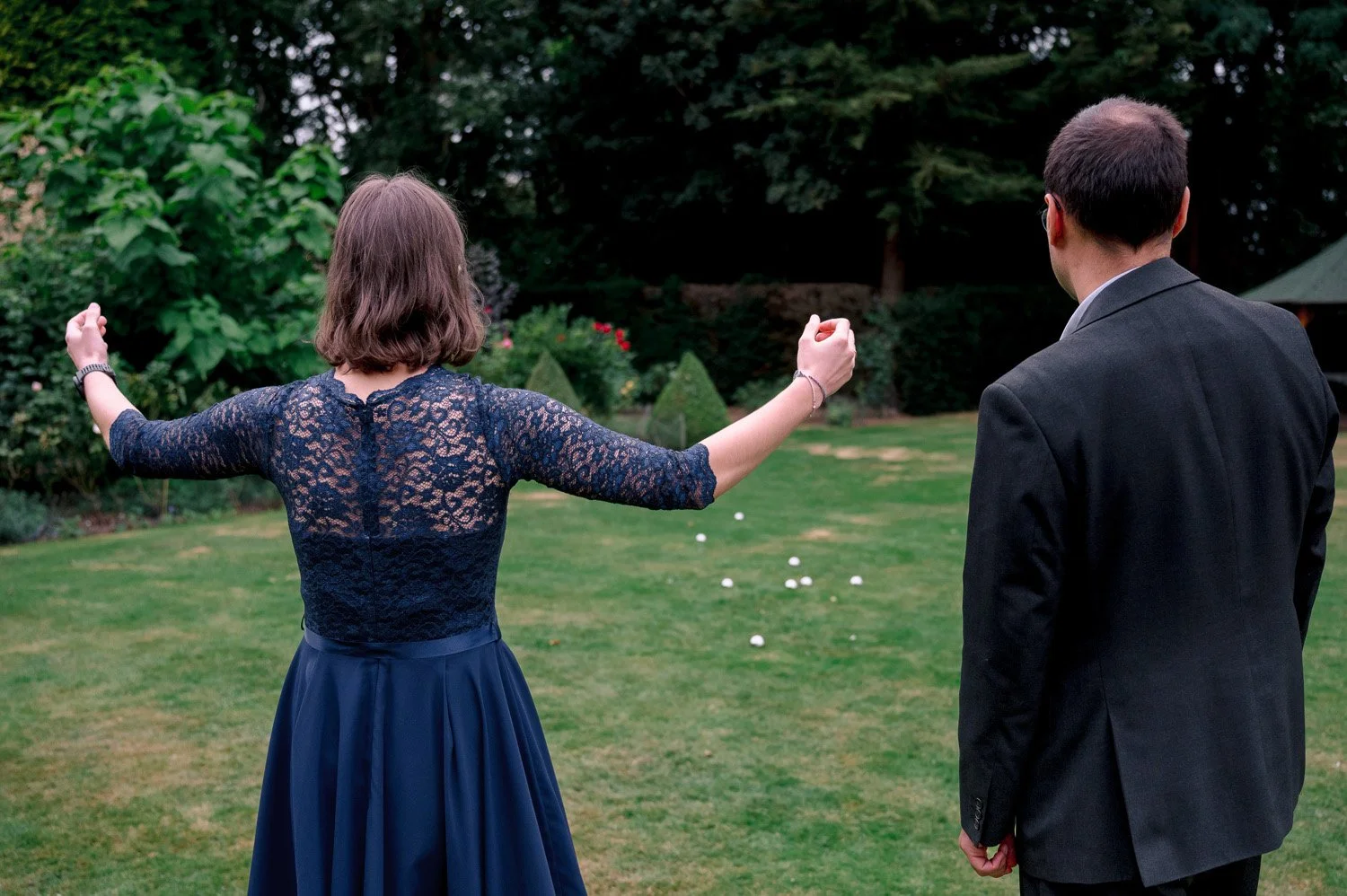 A guest celebrates a winning throw playing boules at Hutton Hall