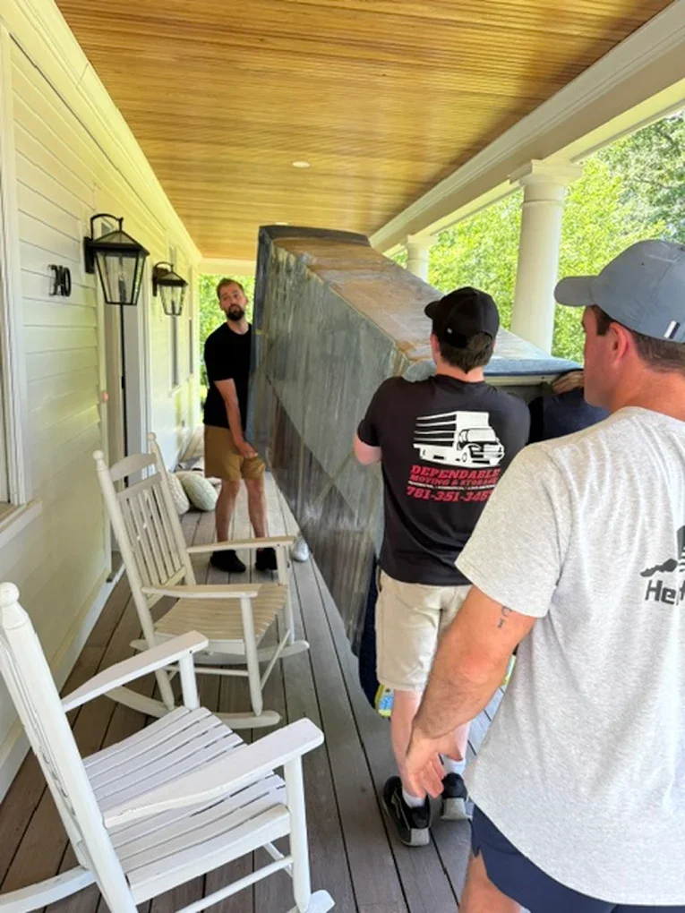 movers bringing in big furniture to home