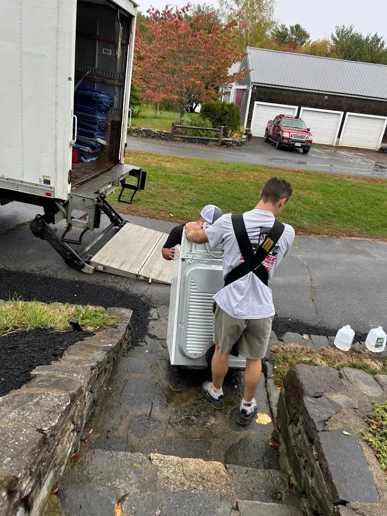 Worker unloading commercial client move