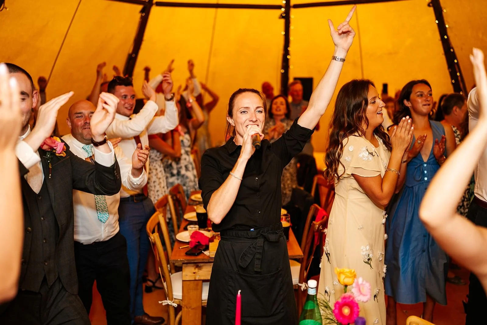 singing waiters performing tipi weddin