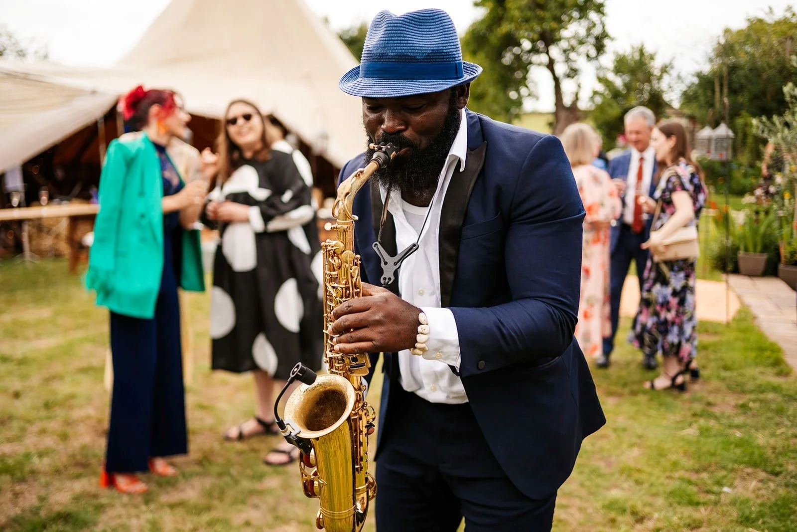 saxophone player at tipi wedding