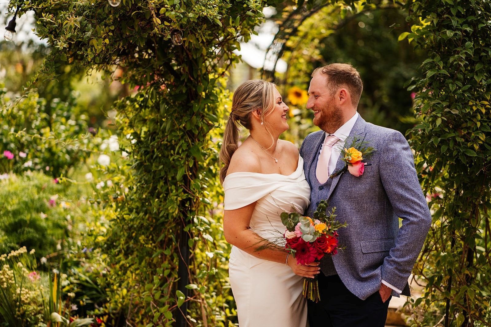 bride and groom under hedgeway tipi wedding