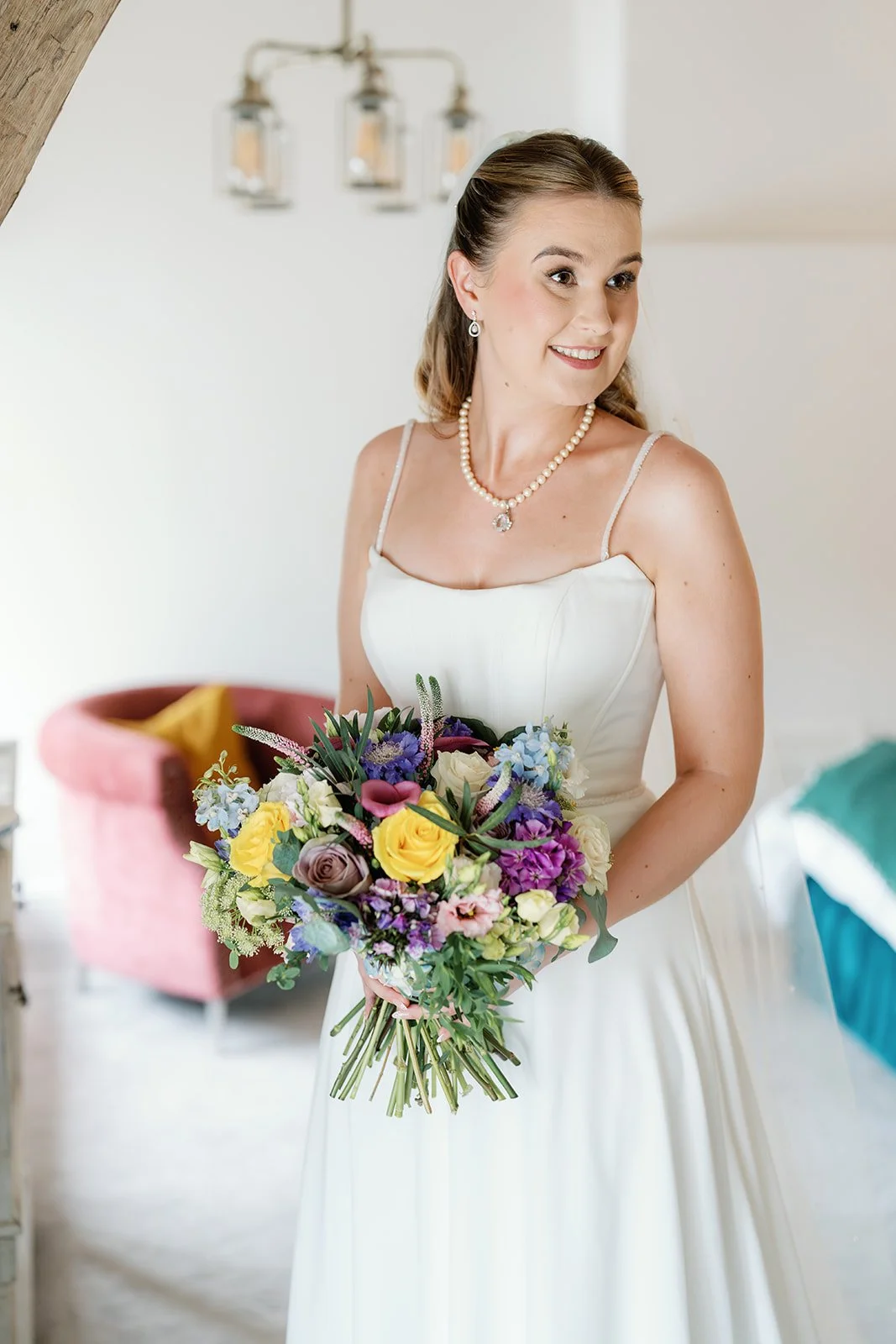 bride with bouquet looking over shoulder.jpg