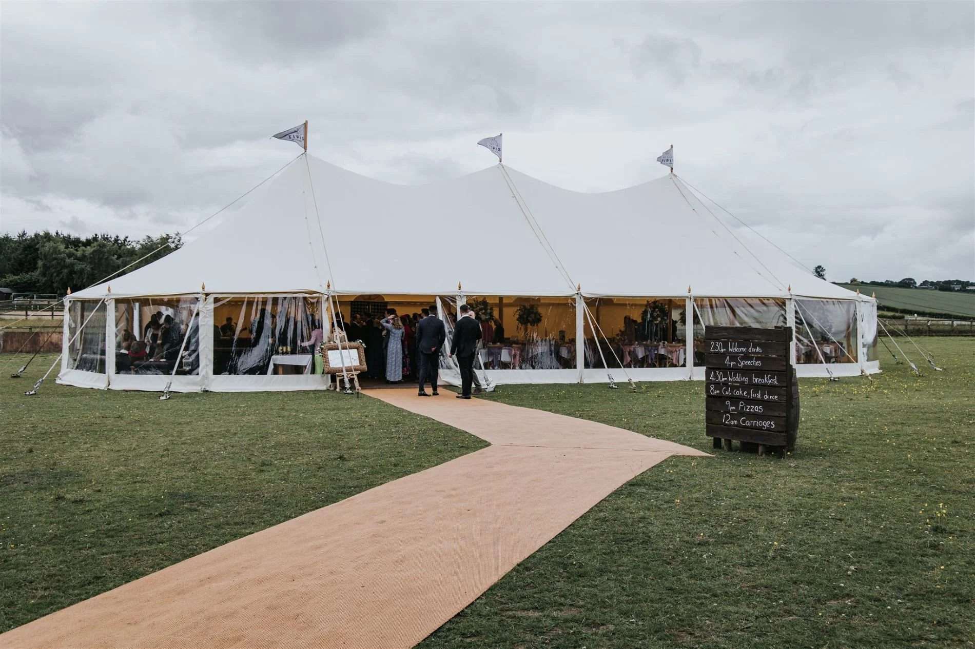 Marquee wedding showing drinks reception inside marquee