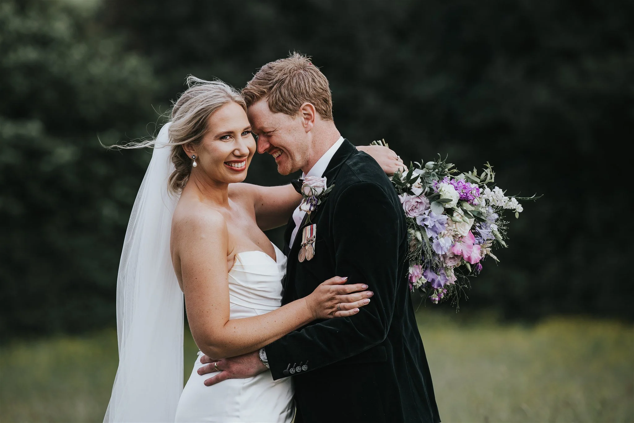 Bride and groom outdoors on their farm