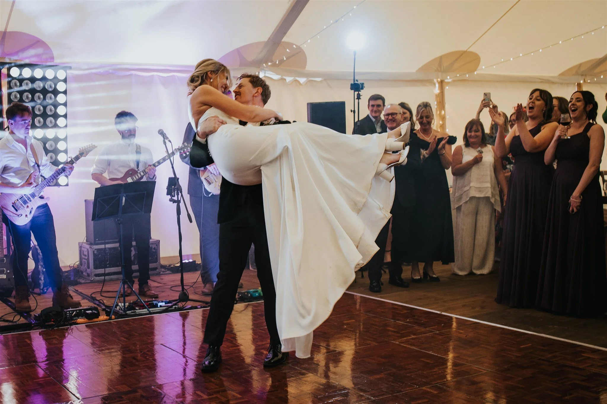 bride and groom first dance at marquee wedding
