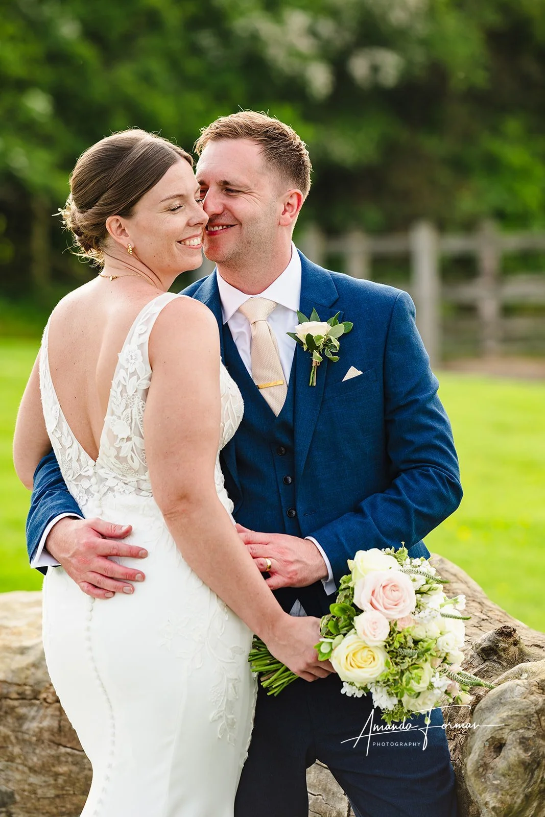 bride and groom with groom kissing cheek.jpg