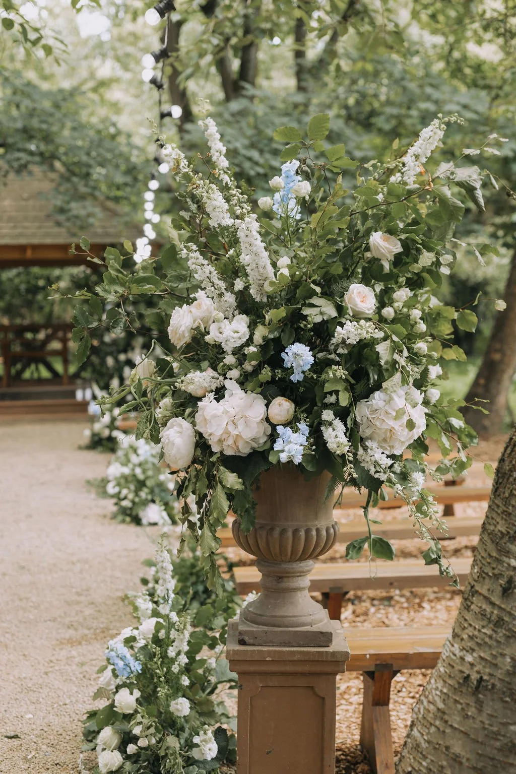 floral display in urn outside of outdoor ceremony.jpg