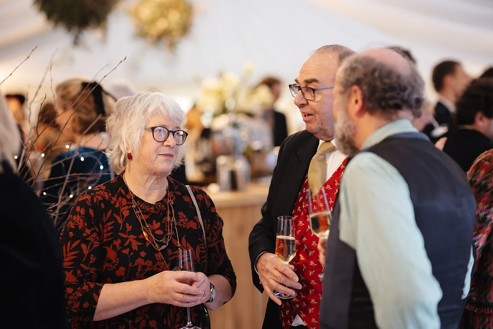 guests enjoying drinks reception at winter marquee wedding
