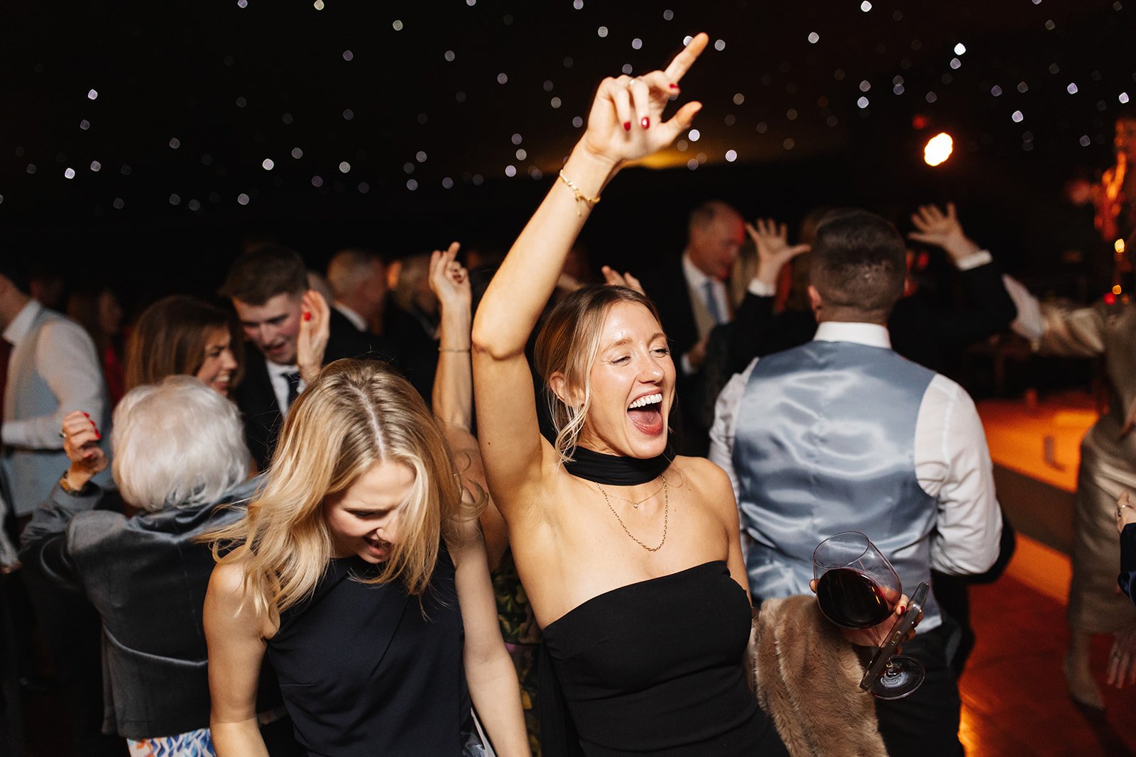 Guests dancing at winter wedding marquee party