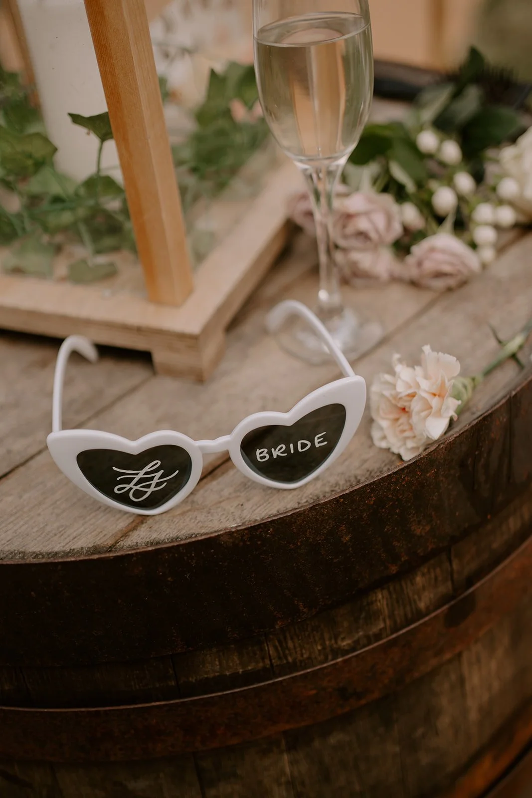 bride wedding sunglasses with flowers and champagne