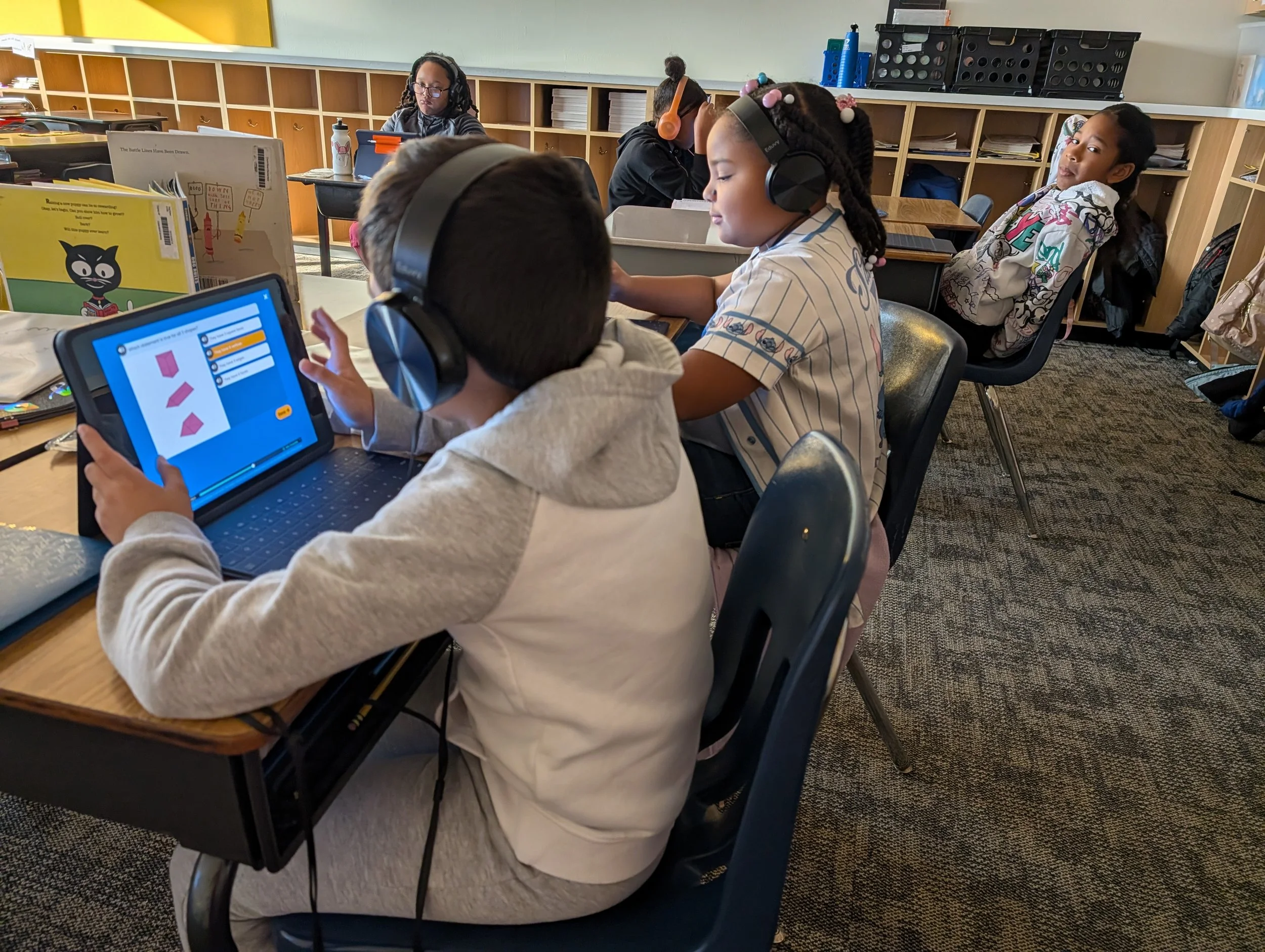 Conn-West students enjoying new classroom headphones.