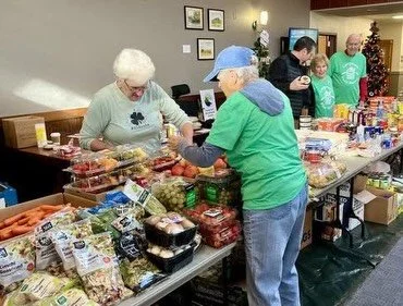 Thanks to our passionate team of volunteers and some surprise musical guests, our December Senior Center food distribution was a festive success! 

We fed 180 people with over 1,700 lbs of food and enjoyed carols from a ukulele duo who brought the ho
