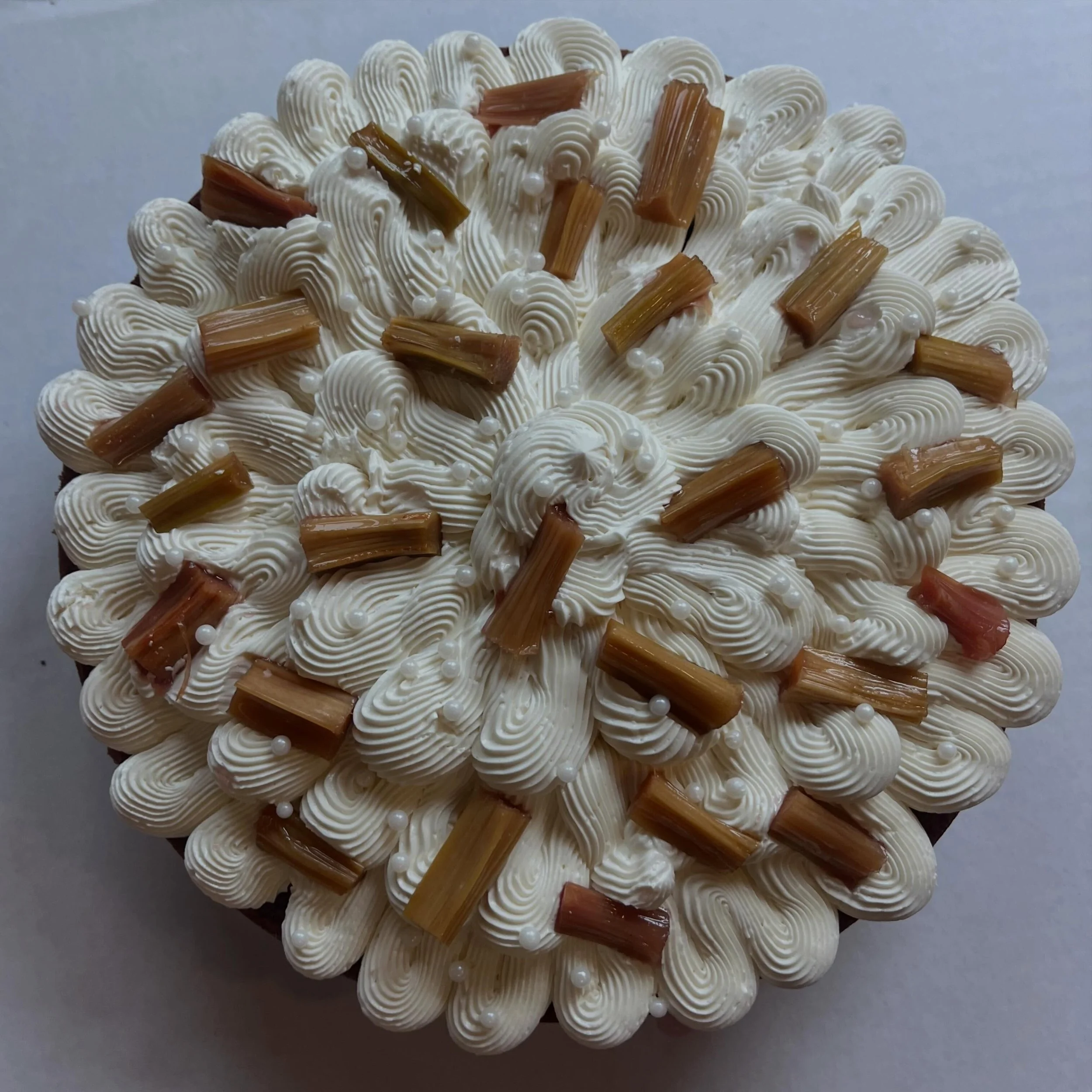 TONS of cakes at the store today! And more tomorrow!  8:30-6 today &amp; 8:30-sold out tomorrow.  Xoxoxo, Wide Awake 😘

Image 1: 100% einkorn cake (thanks @farmergroundflour ✨), vanilla SMBC, rhubarb batons poached in syrup.

Image 2: individual evo